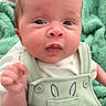 baby, infant, child, face, eyes, expression, clothing, onesie, overalls, bunny_design, hand, fist, blanket, green, cute, portrait, closeup, skin, newborn, soft