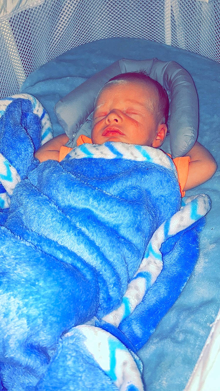 Lakelyn is registered to the contest to win money with this photo: azure, baby, baby_products, baby_sleeping, baby_toddler_clothing, bedtime, blue, child, comfort, electric_blue, eye, face, head, infant_bed, linens, nap, person, room, sleep, textile