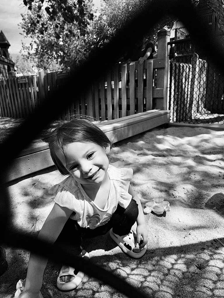 Lillani joined the competition — help win amazing prizes! backyard, child, clothing, face, female, fence, footwear, girl, grass, head, nature, outdoorplayarea, outdoors, person, photography, plant, playarea, portrait, shoe, yard