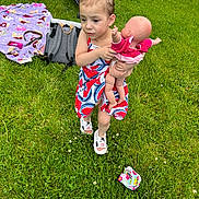Lillani is registered to the contest to win money with this photo: accessories, baby, backyard, bag, clothing, dress, face, grass, head, lawn, nature, outdoors, park, person, photography, plant, portrait, shorts, summer, yard