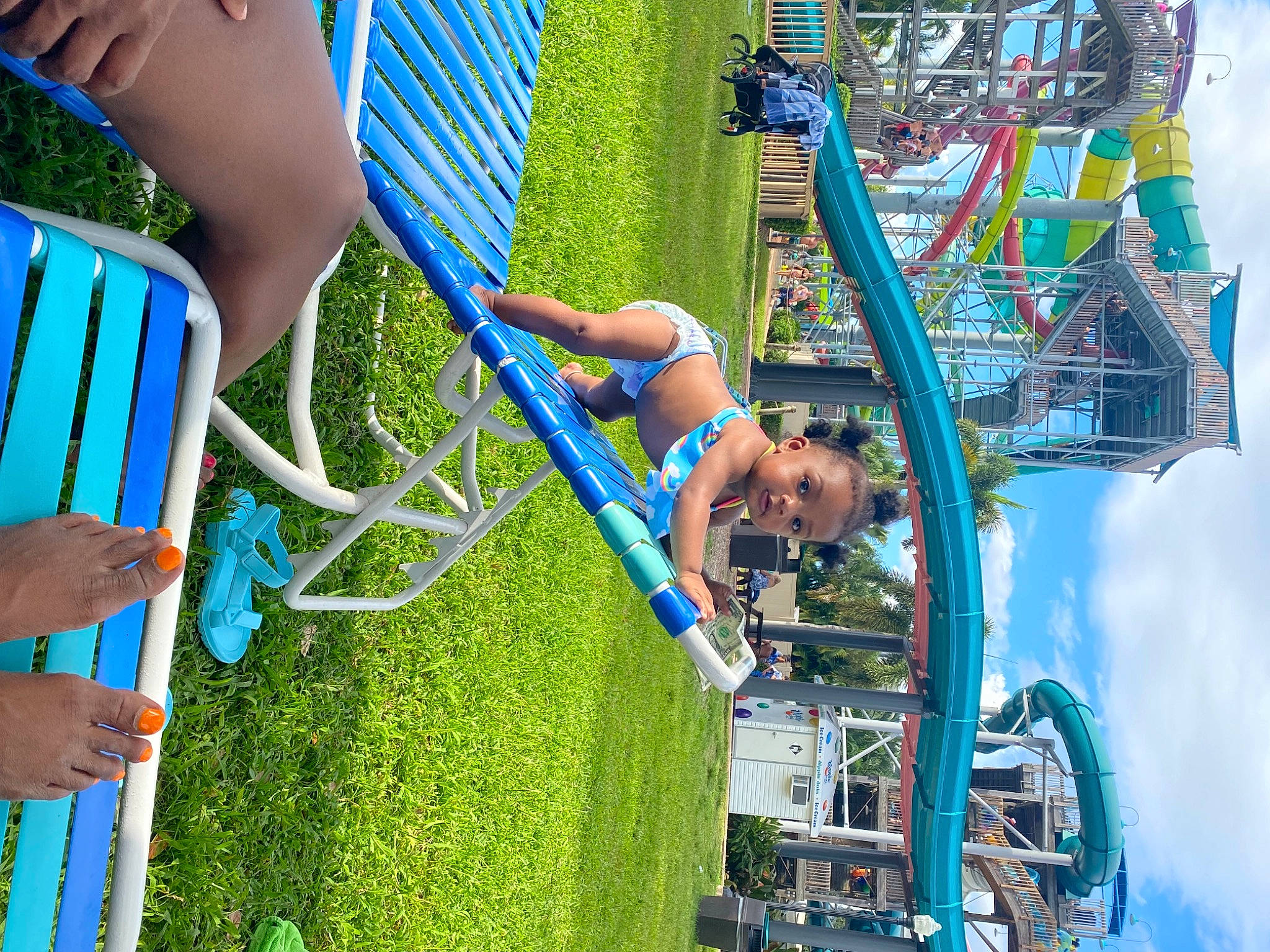 Amaryi is registered to the contest to win money with this photo: amusement_ride, blue, city, daytime, electric_blue, engineering, fun, grass, green, human_settlement, leisure, nature, outdoor_play_equipment, people, people_in_nature, person, pole, public_space, recreation, t_shirt