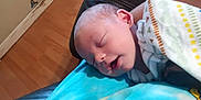 Brandon is registered to the contest to win money with this photo: architecture, baby, blanket, building, clothing, cushion, face, furniture, glove, head, homedecor, hospital, newborn, person, photography, portrait, quilt, sleeping, yawning