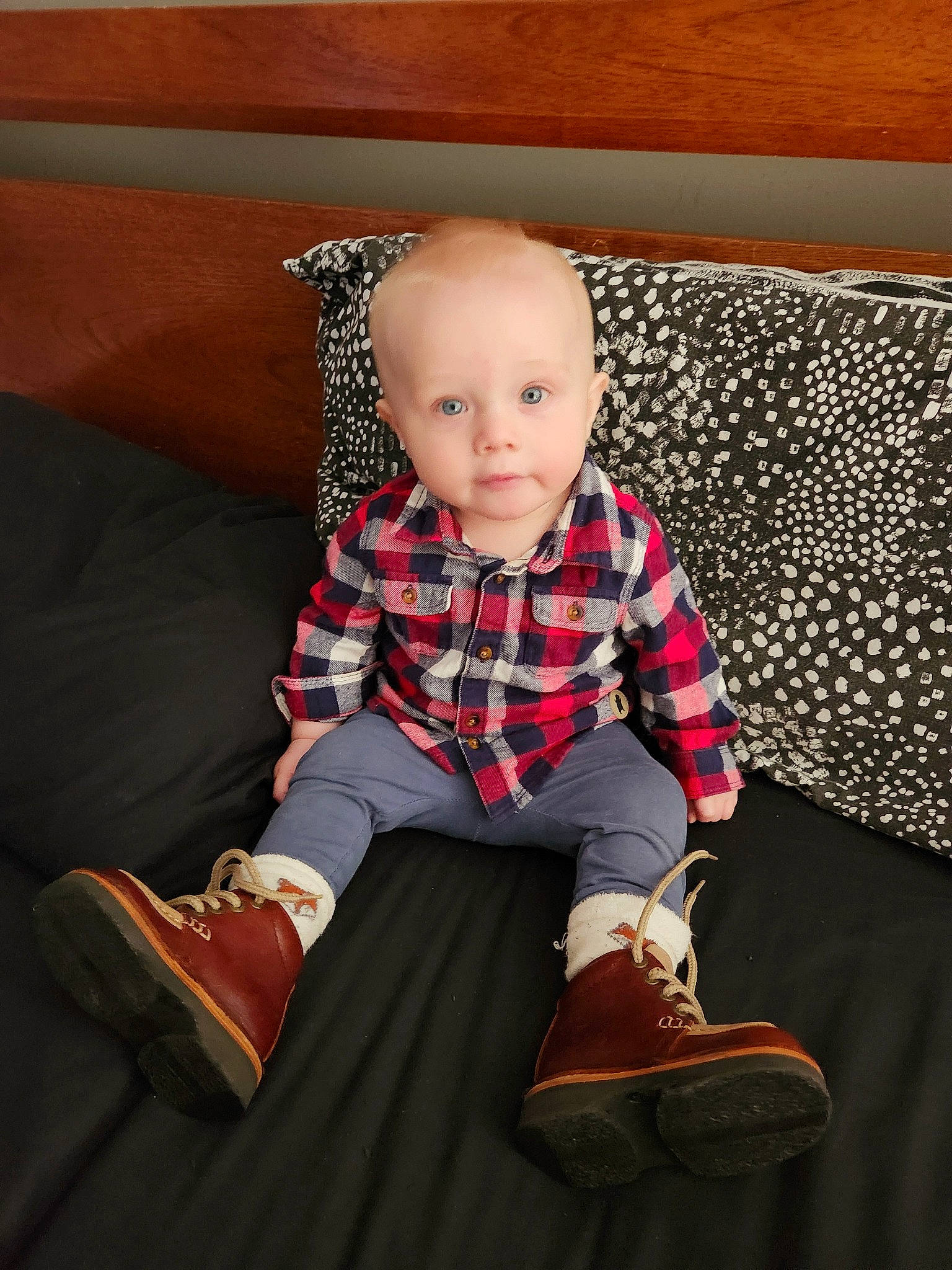 Dakota is registered to the contest to win money with this photo: baby, baby_toddler_clothing, collar, comfort, couch, flooring, head, knee, lap, leg, pattern, person, plaid, sitting, sleeve, smile, sock, tartan, textile, toddler