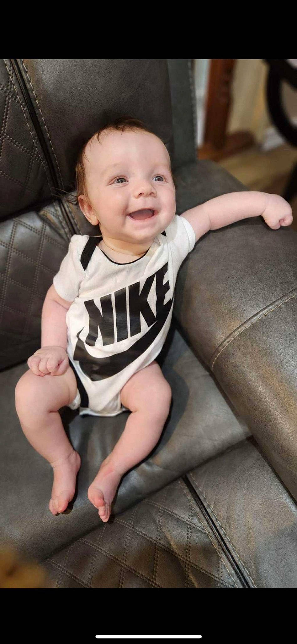 Malakai joined the competition — help win amazing prizes! baby, baby_toddler_clothing, cheek, comfort, couch, eye, face, finger, flash_photography, floor, happy, head, iris, leg, person, skin, sleeve, smile, t_shirt, thigh