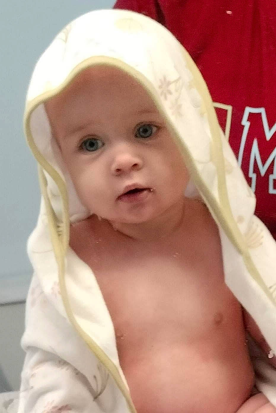 Aurora is registered to the contest to win money with this photo: abdomen, baby, baby_products, bonnet, cap, cheek, chest, child, eye, eyebrow, eyelash, fashion_accessory, fun, happy, hat, headwear, person, portrait_photography, room, smile