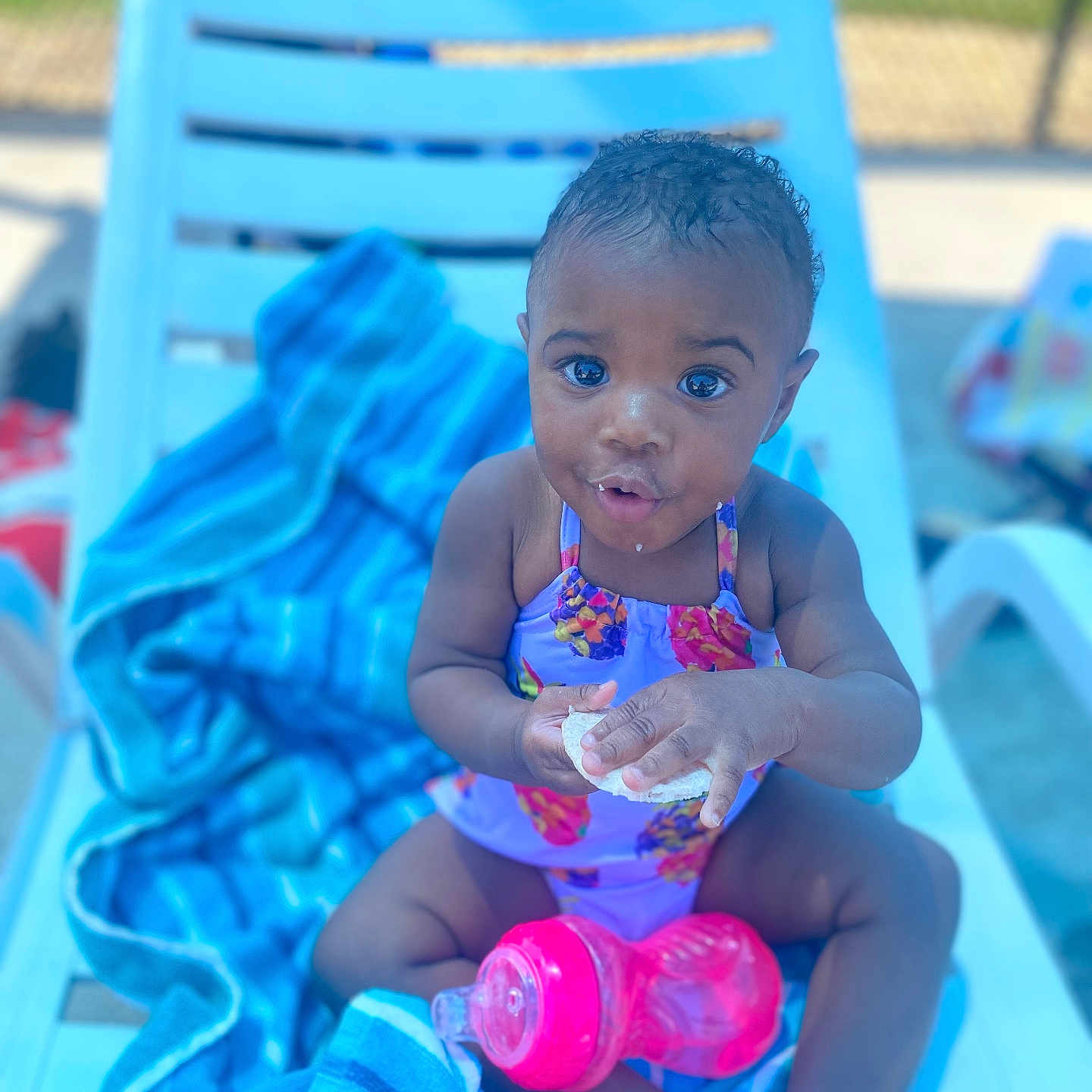 Christyanna is registered to the contest to win money with this photo: baby, bodypart, clothing, cream, cutlery, dessert, face, finger, food, glove, hand, head, icecream, person, photography, portrait, sitting, spoon, summer, swimwear