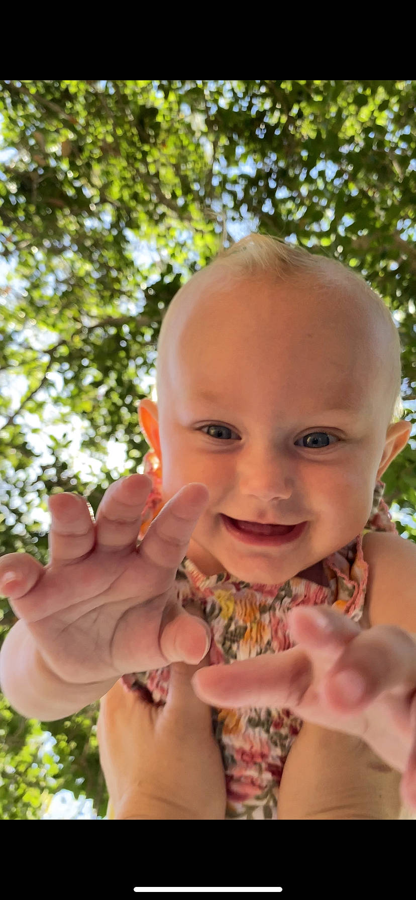 Alice is registered to the contest to win money with this photo: baby, child, finger, fun, gesture, grass, hand, happy, joy, leaf, lip, mouth, nail, people_in_nature, person, plant, skin, smile, soil, thumb
