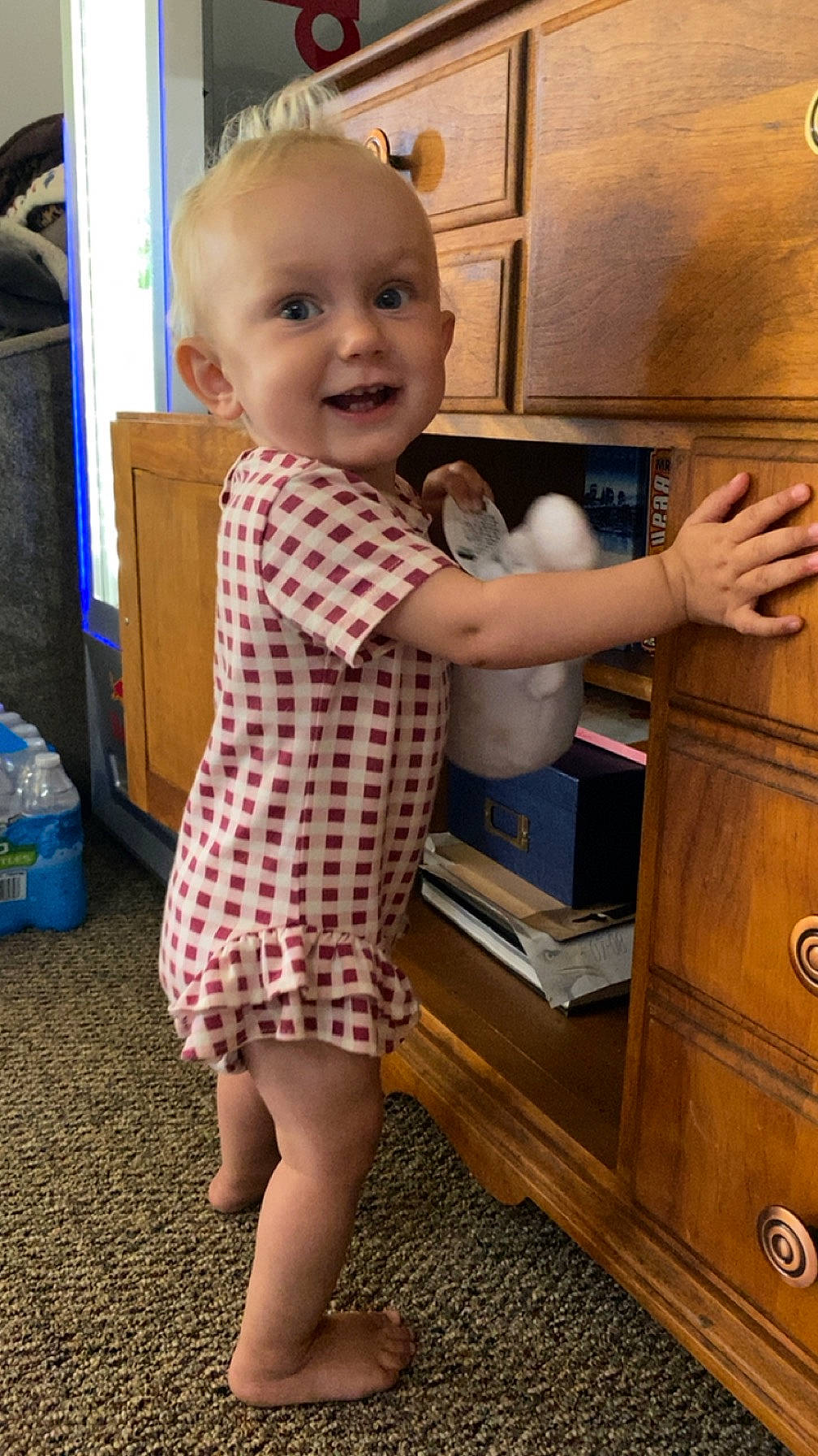 Alice joined the competition — help win amazing prizes! baby, baby_toddler_clothing, cabinetry, child, drawer, finger, floor, flooring, hairstyle, head, human_leg, joint, joy, person, shoulder, smile, standing, thigh, thumb, toddler