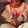 baby, sleeping, pink_bow, mittens, blanket, sweater, infant, cozy, cute, child, portrait, rest, soft, warm, indoor, peaceful, clothing, headband, newborn, face