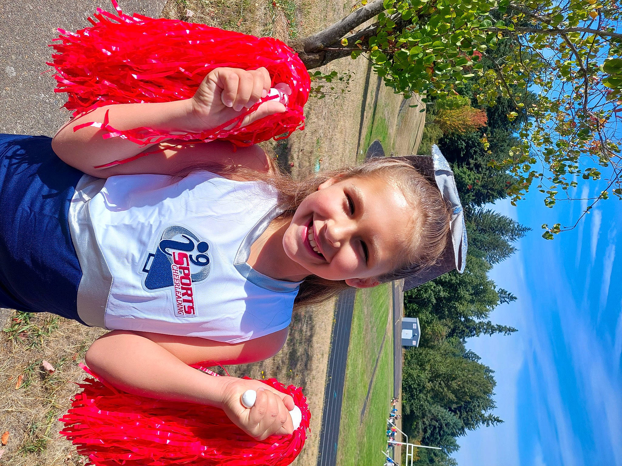 Mya joined the competition — help win amazing prizes! blue, carmine, child, event, fun, grass, green, happy, joy, laugh, leisure, people_in_nature, person, pink, plant, recreation, red, sky, smile, t_shirt