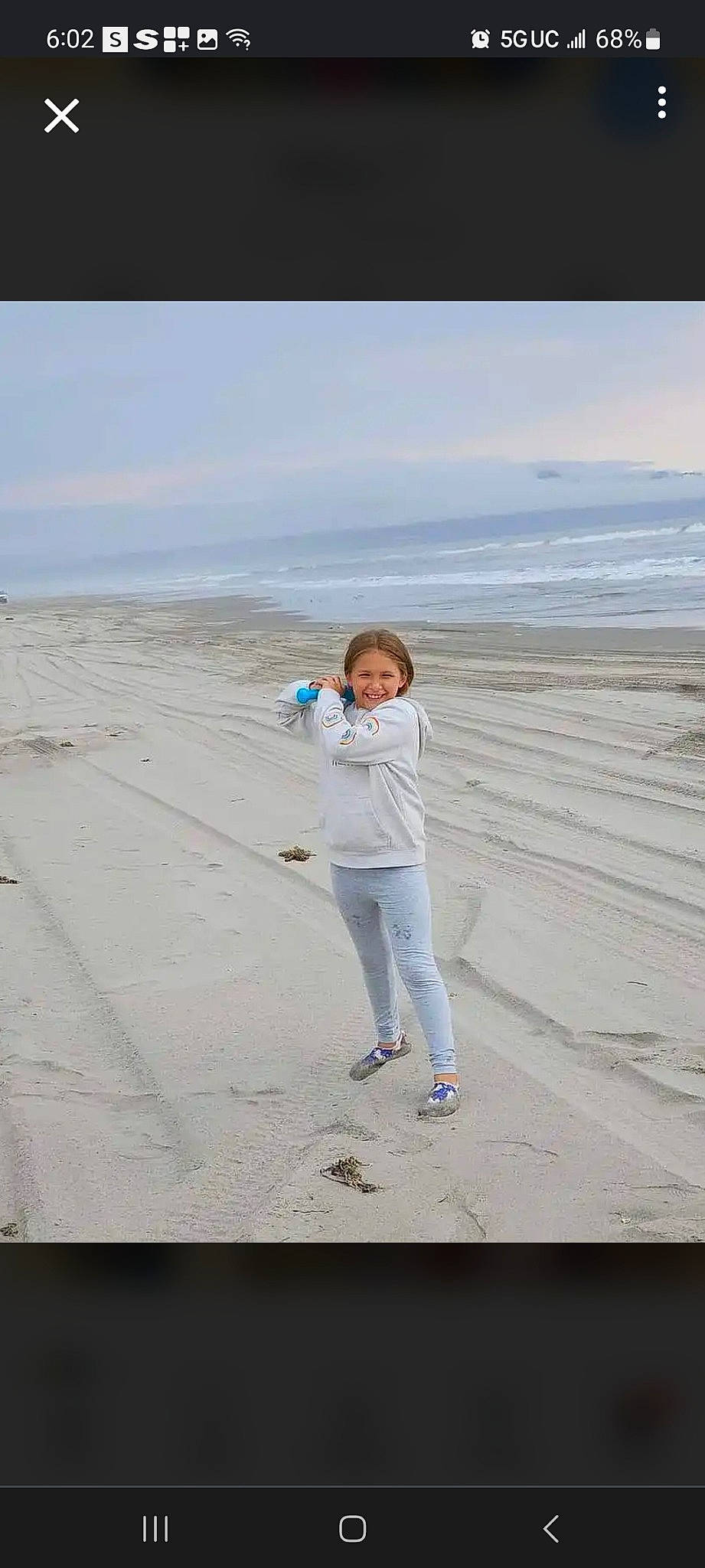 Mya is registered to the contest to win money with this photo: beach, cloud, coast, ecoregion, electric_blue, fun, gesture, happy, horizon, joy, landscape, leisure, ocean, people_in_nature, person, recreation, sand, shore, sky, travel