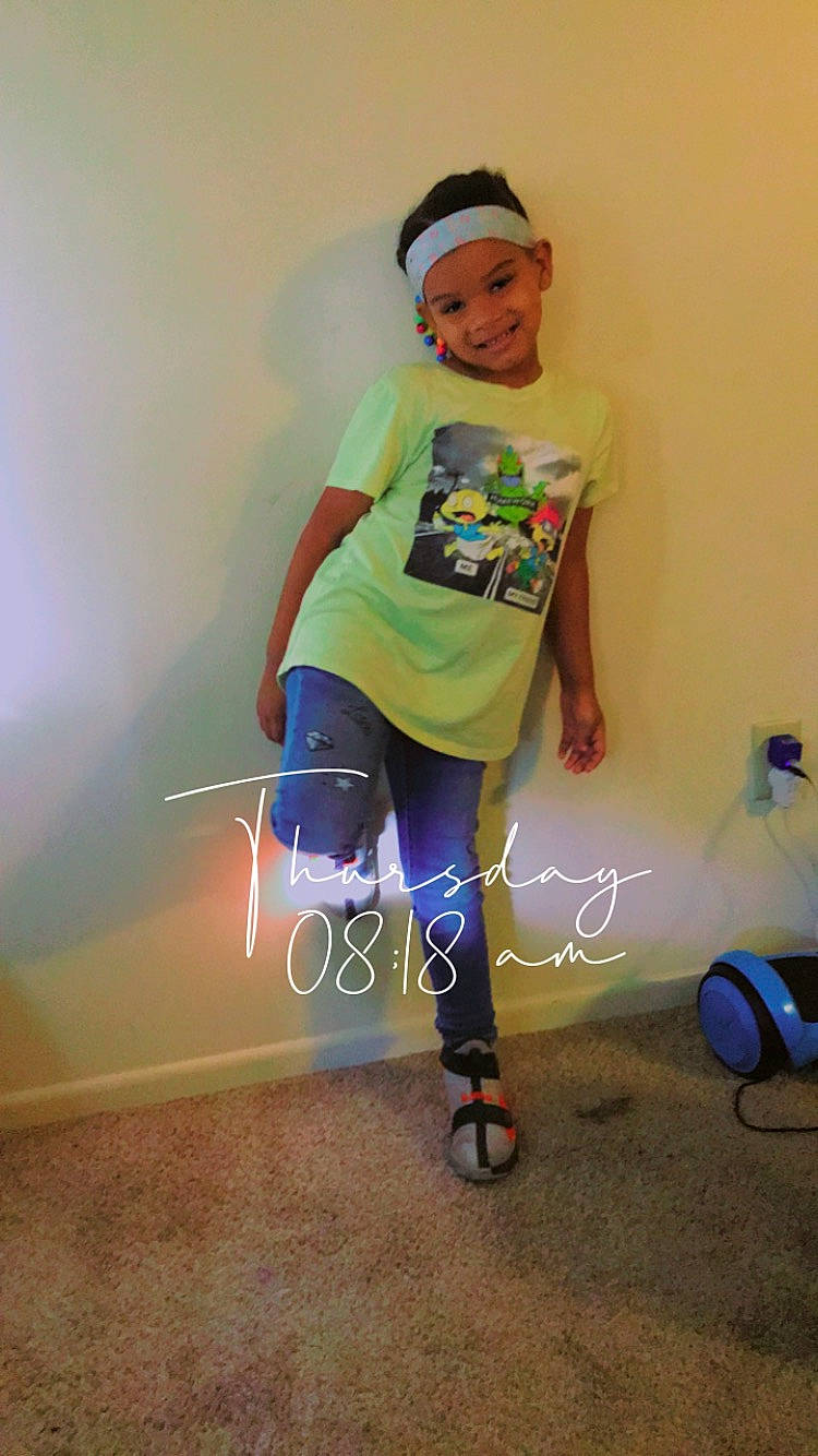 Serenity is registered to the contest to win money with this photo: baseball_cap, cap, child, electric_blue, entertainment, flash_photography, flooring, font, fun, happy, headwear, joy, leisure, magenta, performing_arts, person, personal_protective_equipment, sleeve, smile, sportswear