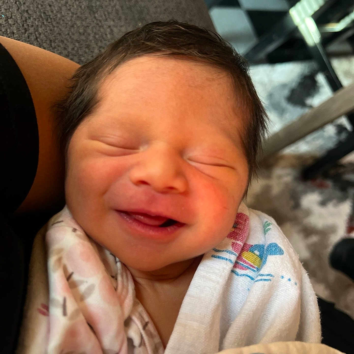 Johana is registered to the contest to win money with this photo: baby, blanket, child, closeup, comfort, cozy, cute, face, hair, human, indoor, infant, newborn, peaceful, person, resting, skin, sleeping, smiling, wrapped