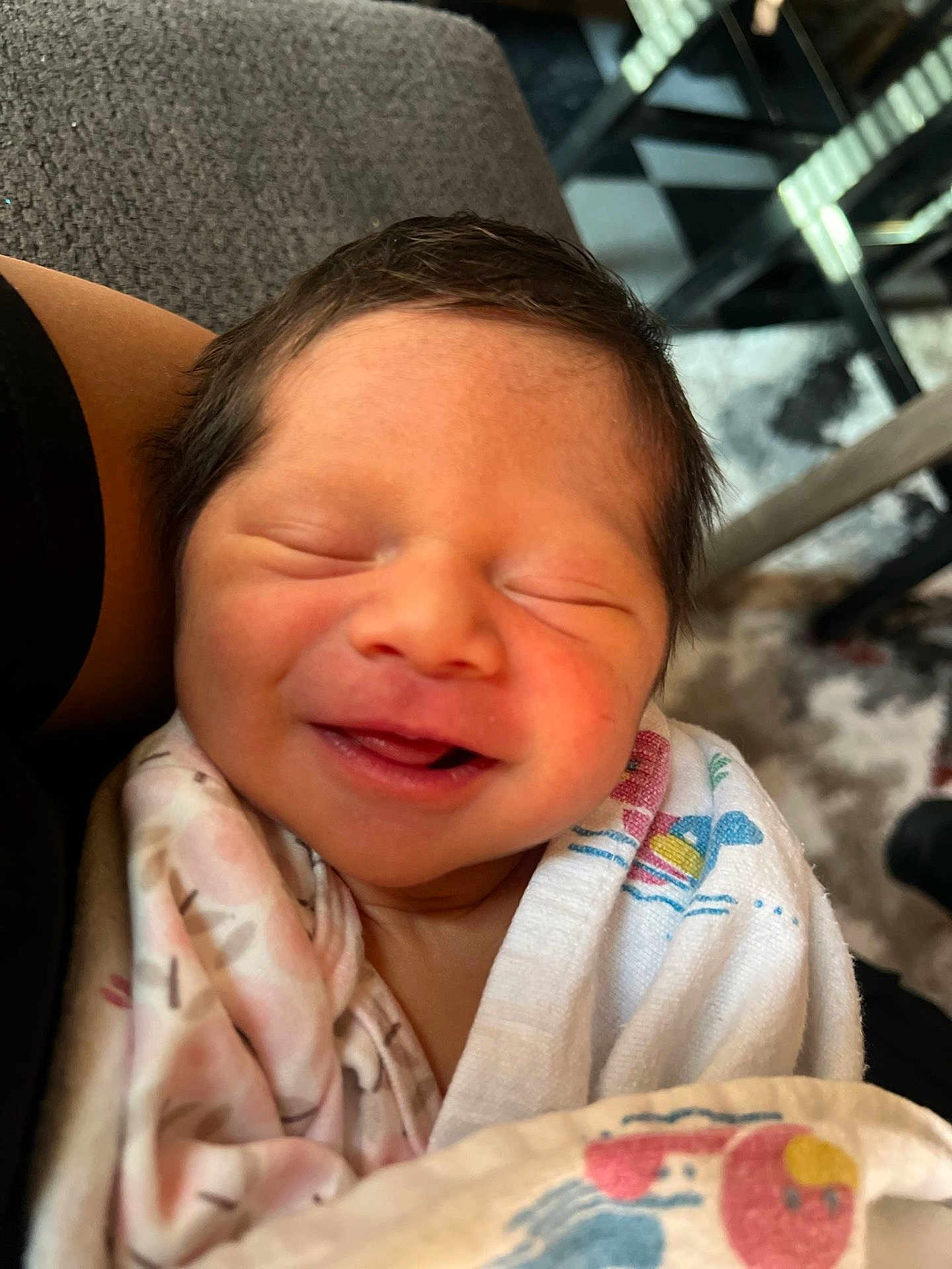 Johana is registered to the contest to win money with this photo: newborn, baby, infant, sleeping, smiling, wrapped, blanket, closeup, person, face, hair, skin, cozy, resting, comfort, indoor, human, cute, peaceful, child