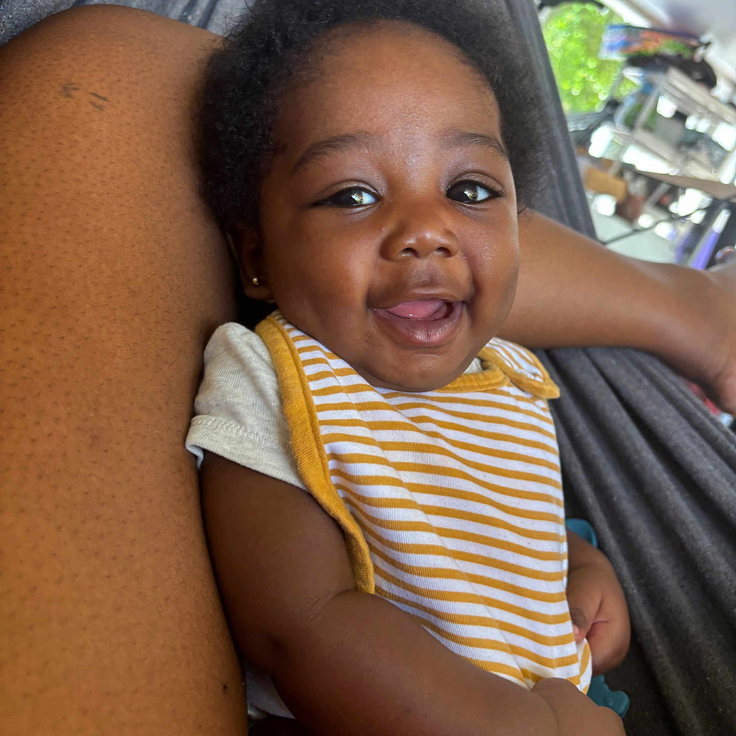 Alexanderisaac is registered to the contest to win money with this photo: arm, baby, casual, child, closeup, comfort, cute, daylight, hammock, happy, infant, outdoor, person, portrait, relaxing, resting, skin, smiling, striped_bib, young