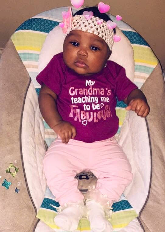 Emoni Griffith is registered to the contest to win money with this photo: baby, baby_products, baby_toddler_clothing, cheek, child, hair_accessory, headgear, headwear, person, pink, product, purple, smile, toddler