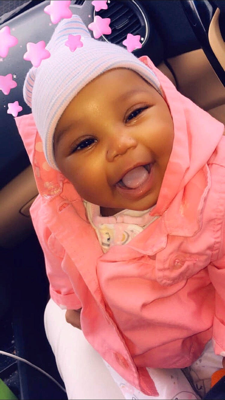 Emoni Griffith is registered to the contest to win money with this photo: baby, cheek, child, daughter, face, facial_expression, forehead, headgear, headwear, lip, mouth, nose, person, pink, skin, smile, toddler