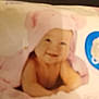 baby, child, towel, pink, smile, face, cute, soft, infant, hooded_towel, skin, baby_towel, pastel, indoor, happy, portrait, person, young_child, baby_bath, cuteness
