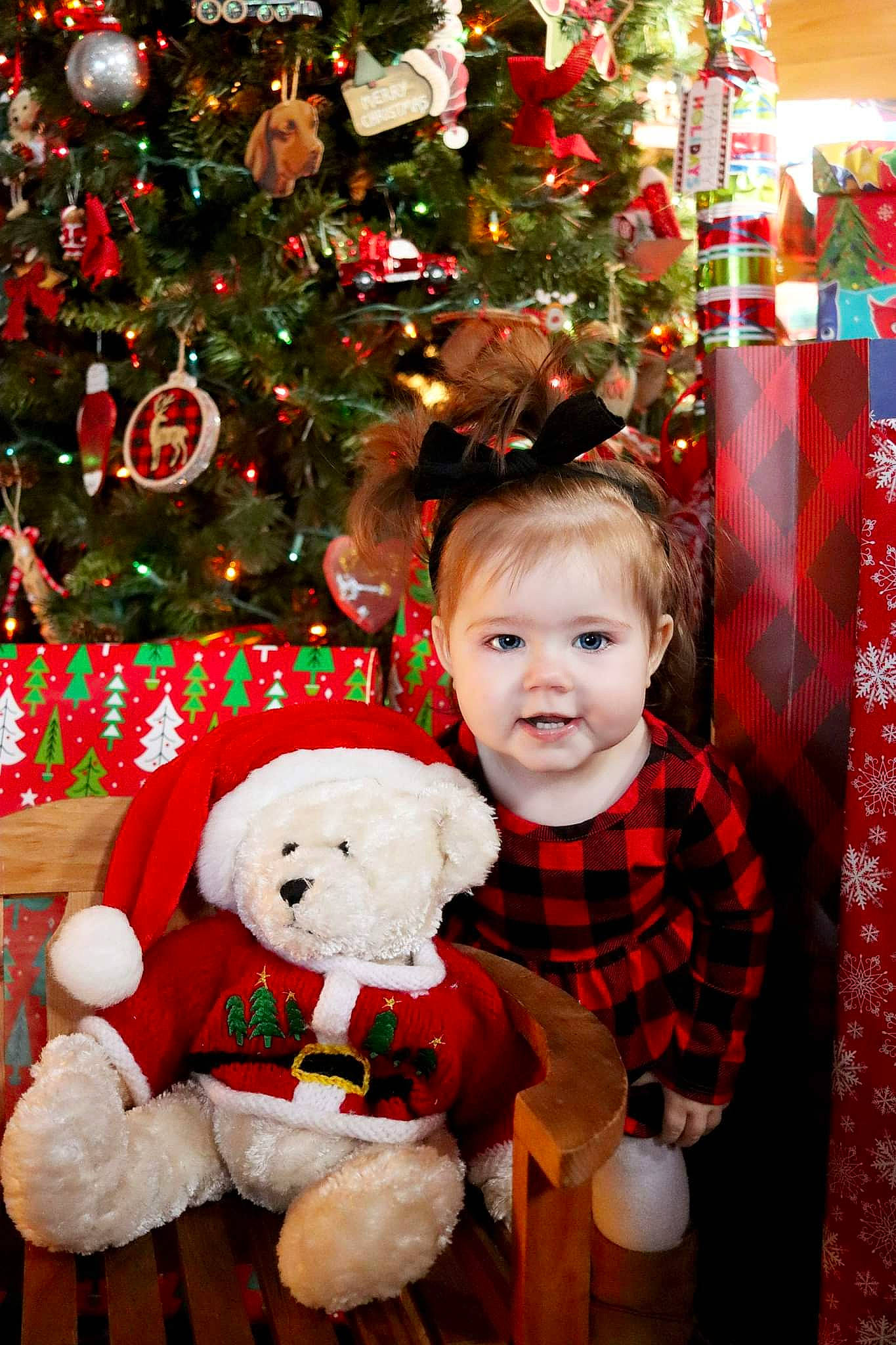 Addilyn joined the competition — help win amazing prizes! child, christmas, christmas_decoration, christmas_eve, christmas_ornament, christmas_tree, conifer, event, happy, holiday, holiday_ornament, lap, ornament, person, photograph, red, smile, snapshot, toddler, tradition
