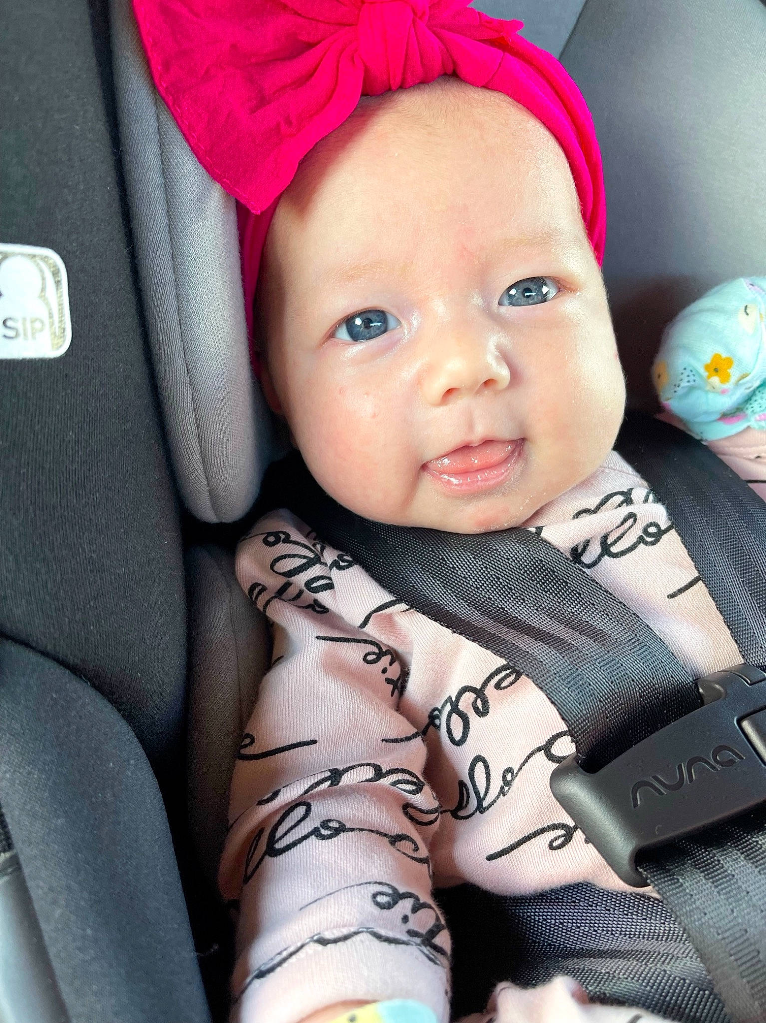 Alaiya joined the competition — help win amazing prizes! baby, baby_toddler_clothing, cap, car_seat, cheek, child, comfort, eye, face, facial_expression, finger, hand, happy, headwear, outerwear, person, pink, product, skin, sleeve