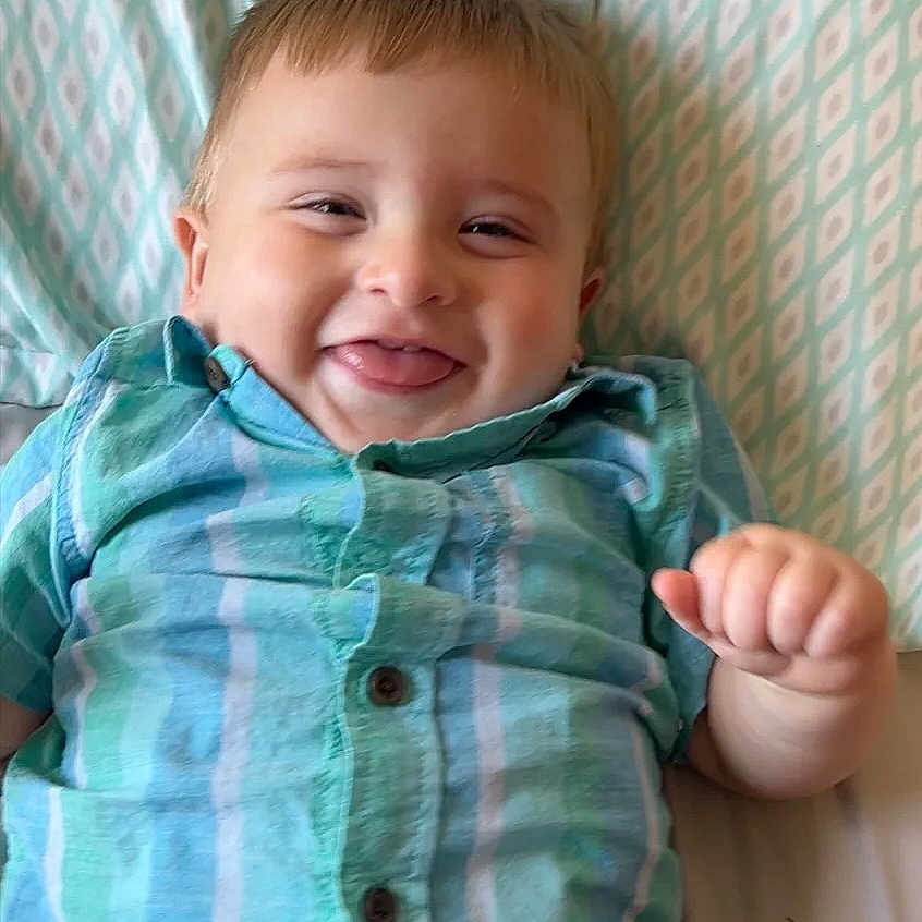 Daxon is registered to the contest to win money with this photo: baby, babylaughing, blouse, bodypart, clothing, face, finger, hand, happy, head, jeans, laughing, mouth, pants, person, photography, portrait, shirt, smile, teeth