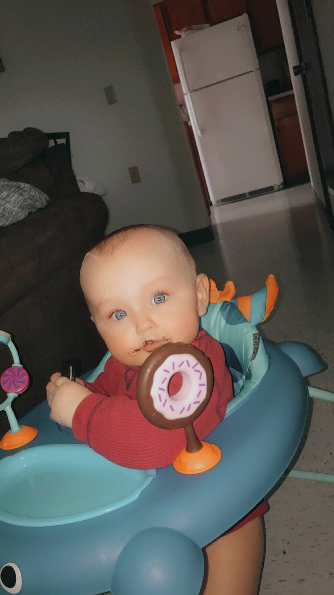 Maverik joined the competition — help win amazing prizes! baby, baby_products, baby_toys, carmine, cheek, child, comfort, facial_expression, finger, flooring, fun, lap, mammal, mouth, orange, person, sitting, stuffed_toy, toddler, toy