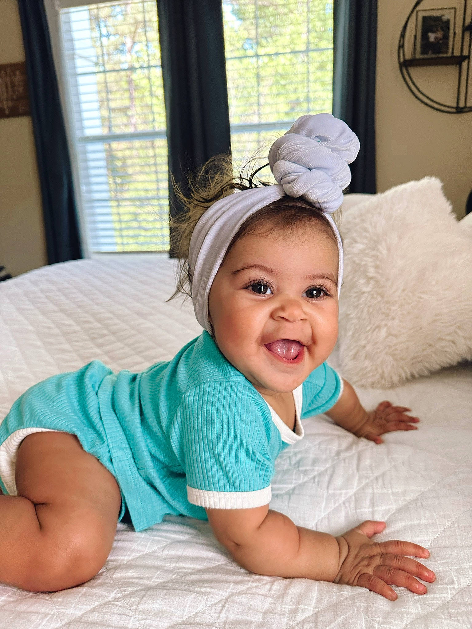 Kailani is registered to the contest to win money with this photo: baby, baby_toddler_clothing, child, comfort, fashion_accessory, flooring, fun, grass, happy, headgear, iris, linens, person, room, sitting, skin, sleeve, smile, textile, toddler