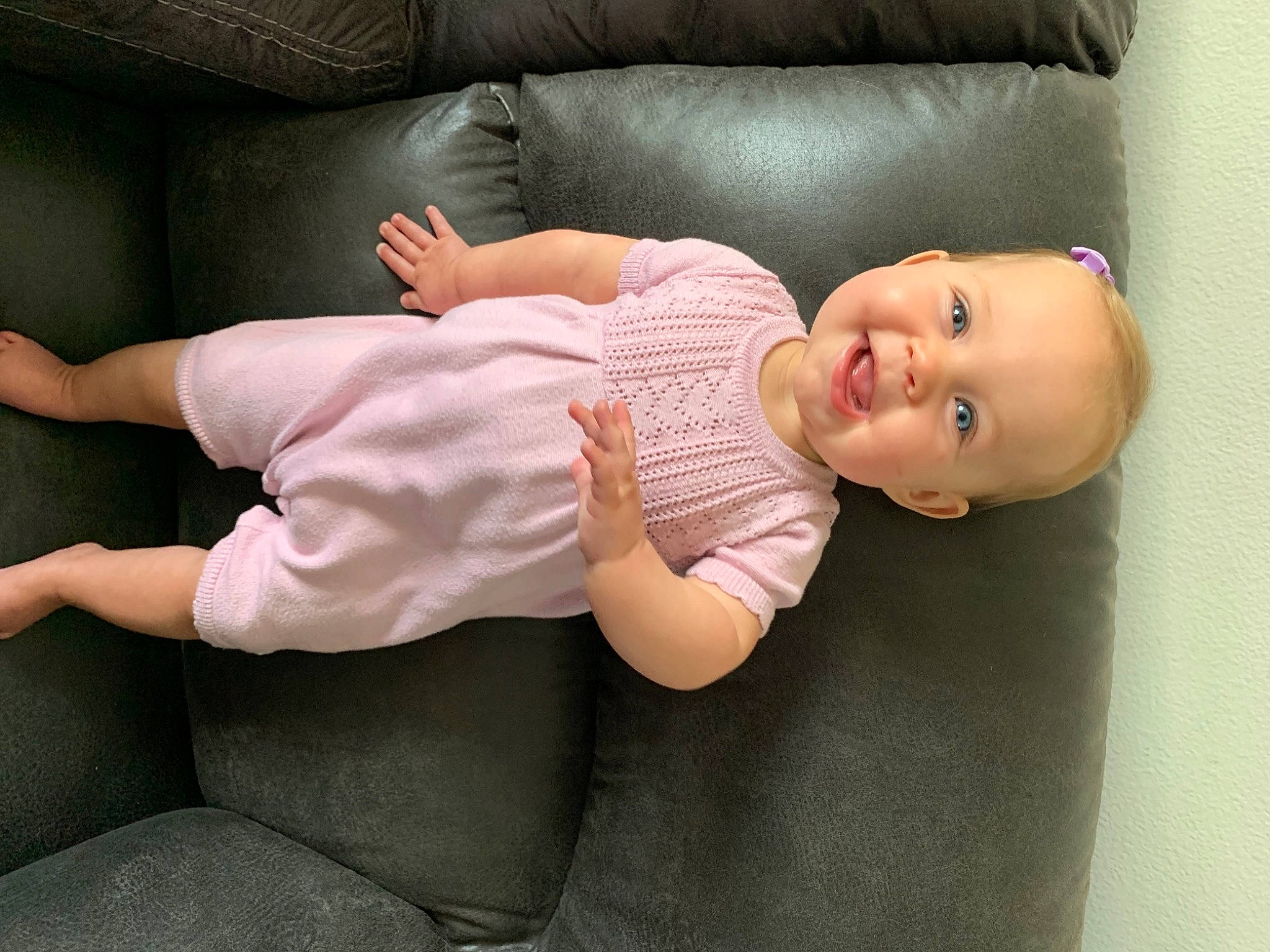 Charolette is registered to the contest to win money with this photo: arm, baby, baby_products, baby_toddler_clothing, cheek, comfort, elbow, eye, finger, hand, human_body, human_leg, joint, joy, knee, leg, lip, person, sitting, sleeve