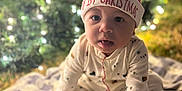 Kingston is registered to the contest to win money with this photo: baby, blanket, bokeh, celebration, child, christmas, christmas_hat, cozy, cute, festive, holiday, indoors, infant, lights, patterned_blanket, portrait, seasonal, sitting, smiling, warm