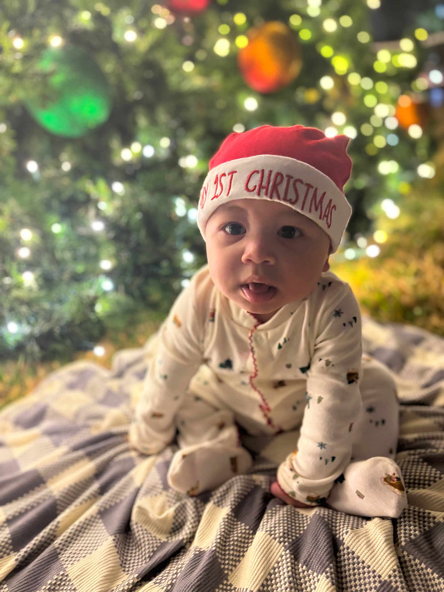 Kingston joined the competition — help win amazing prizes! baby, blanket, celebration, child, christmas, clothing, cute, festive, hat, holiday, indoor, lights, ornaments, pattern, portrait, red, sitting, smile, tree, white