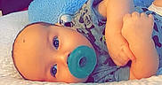Lakoda joined the competition — help win amazing prizes! baby, pacifier, infant, lying_down, blanket, blue, clothing, face, child, cute, skin, head, eyes, hand, soft, comfort, resting, indoors, portrait, young