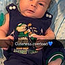 baby, infant, blue_outfit, blanket, cute, lying_down, soft_texture, face, foot, hand, expression, child, indoors, clothing, text_overlay, emoji, cute_baby, portrait, baby_girl, baby_boy