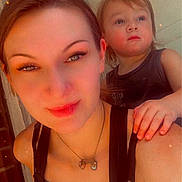 Lakoda joined the competition — help win amazing prizes! casual, child, door, face, hair, hand, light, necklace, outdoor, person, portrait, selfie, shoulder, skin, smile, tank_top, toddler, warm_tone, woman, young_child