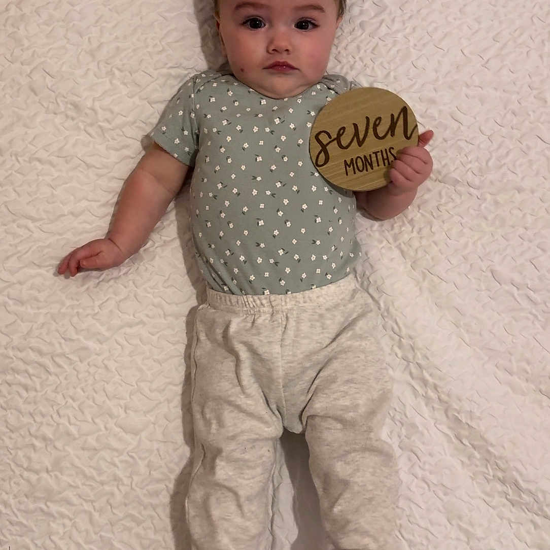 Amara joined the competition — help win amazing prizes! baby, bodypart, clothing, couch, cushion, face, finger, furniture, hand, hardwood, head, homedecor, linen, pants, person, photography, portrait, sleeve, t_shirt, wood