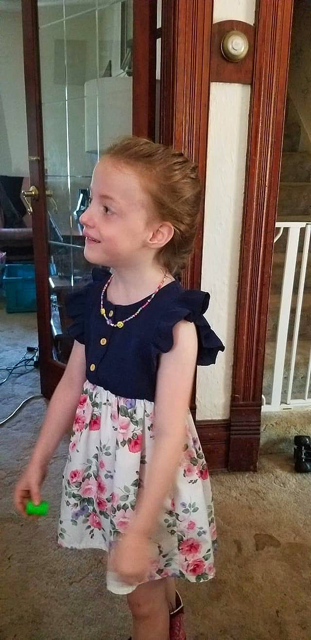 Aleeyah is registered to the contest to win money with this photo: baby_toddler_clothing, blond, brown_hair, child, curtain, day_dress, door, dress, flooring, fun, happy, iris, pattern, person, sitting, sleeve, smile, t_shirt, toddler, waist