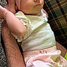 arm, baby, carpet, casual, child, cute, fabric, hand, hat, holding, indoor, infant, newborn, person, pink_clothing, plaid, portrait, resting, soft_lighting, white_clothing