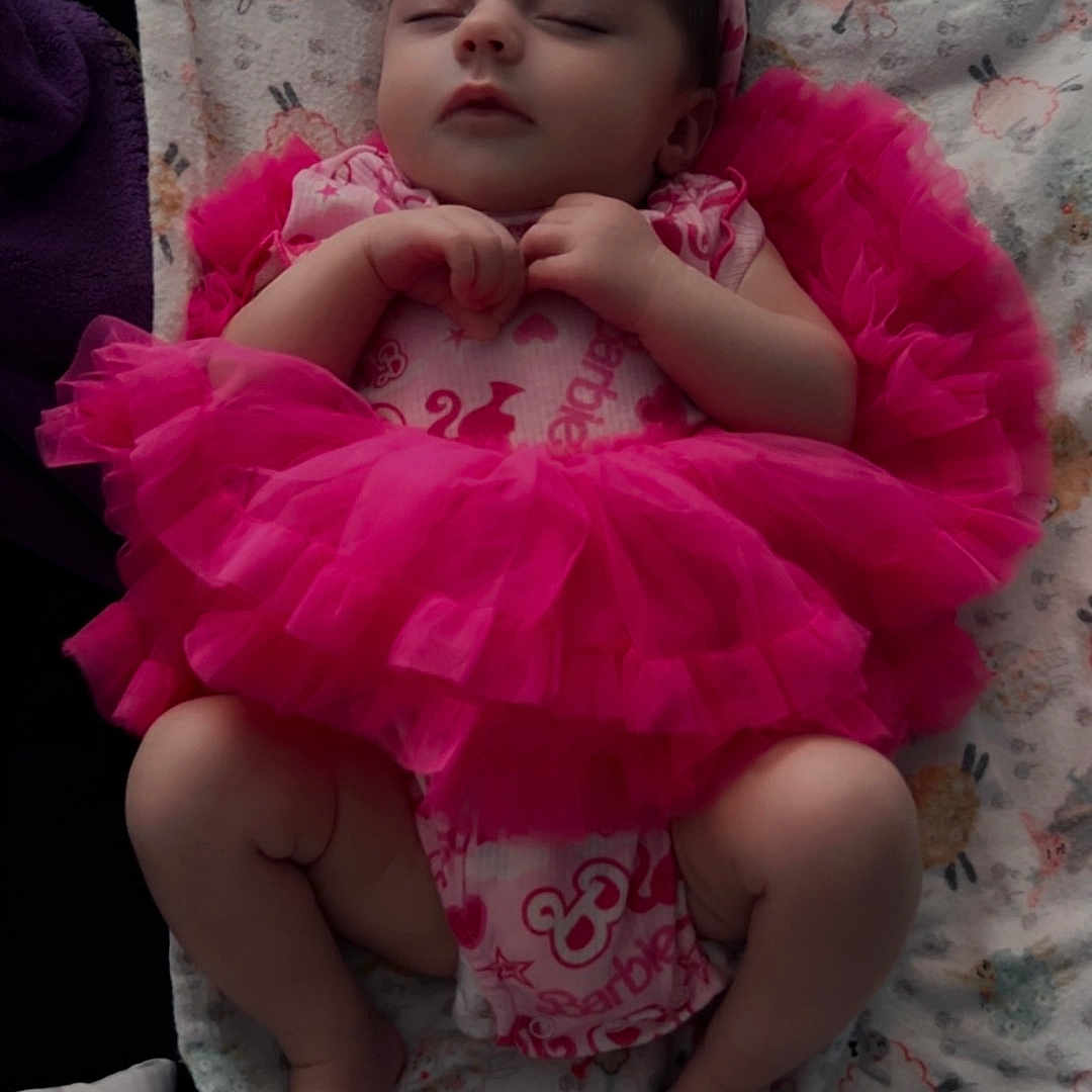 Sóley joined the competition — help win amazing prizes! adorable, baby, blanket, child, closeup, cute, footwear_absent, hands_clasped, headband, indoors, infant, lying_down, patterned_blanket, peaceful, pink_tutu, portrait, resting, sleeping, soft_lighting, toddler