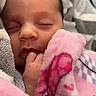 Sóley joined the competition — help win amazing prizes! baby, blanket, child, closeup, cozy, cute, face, gray, hand, indoors, infant, newborn, peaceful, pink, portrait, resting, sleeping, soft, warm, wrapped