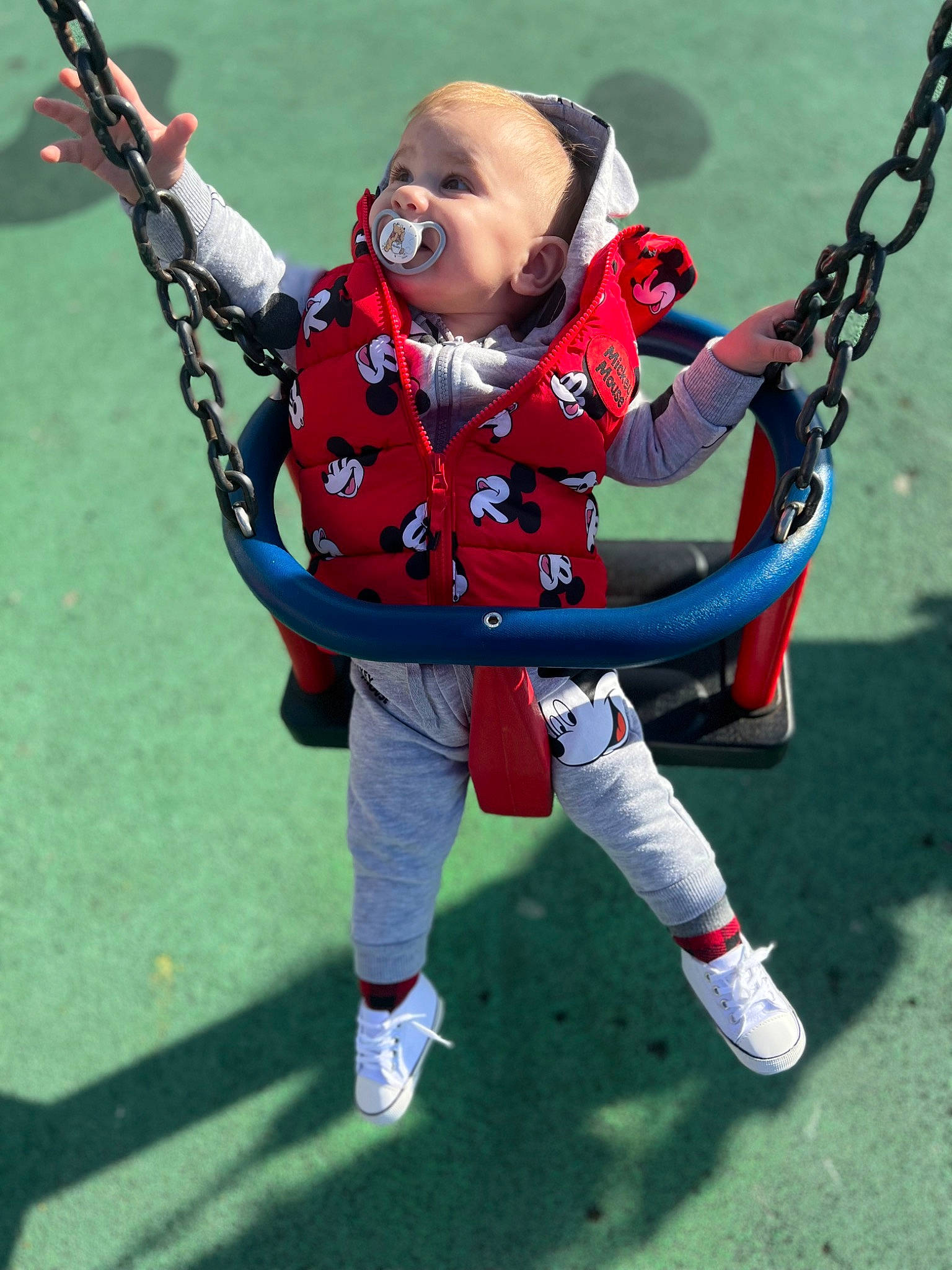 Erick joined the competition — help win amazing prizes! baby, carmine, electric_blue, face, fictional_character, grass, happy, head, human_body, knee, leisure, outdoor_play_equipment, outdoor_recreation, person, personal_protective_equipment, plant, playground, recreation, smile, swing