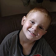 Ezekiel joined the competition — help win amazing prizes! child, boy, smiling, portrait, indoors, couch, seated, spiderman, superhero, t_shirt, clothing, brown_hair, short_hair, fair_skin, head_tilt, happy, camera_facing, home, hanging_clothes, casual