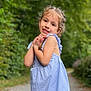 child, girl, smile, portrait, outdoor, nature, greenery, dress, blue, stripes, cute, young, happy, pathway, sunlight, playful, innocence, posing, short_sleeves, braids