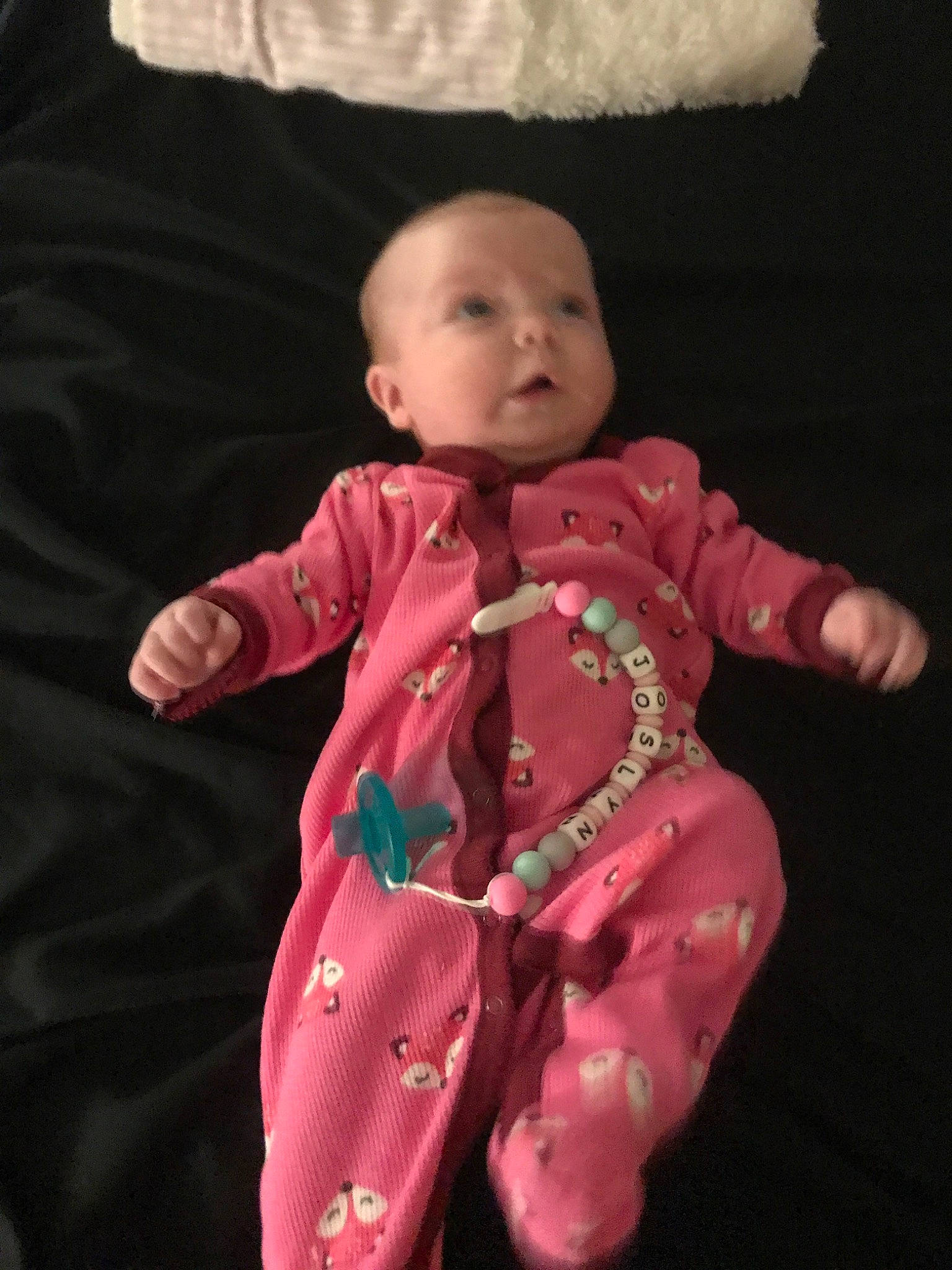 Joslyn is registered to the contest to win money with this photo: baby, cheek, child, dress, eye, face, head, person, pink, skin, smile, standing, toddler, toy