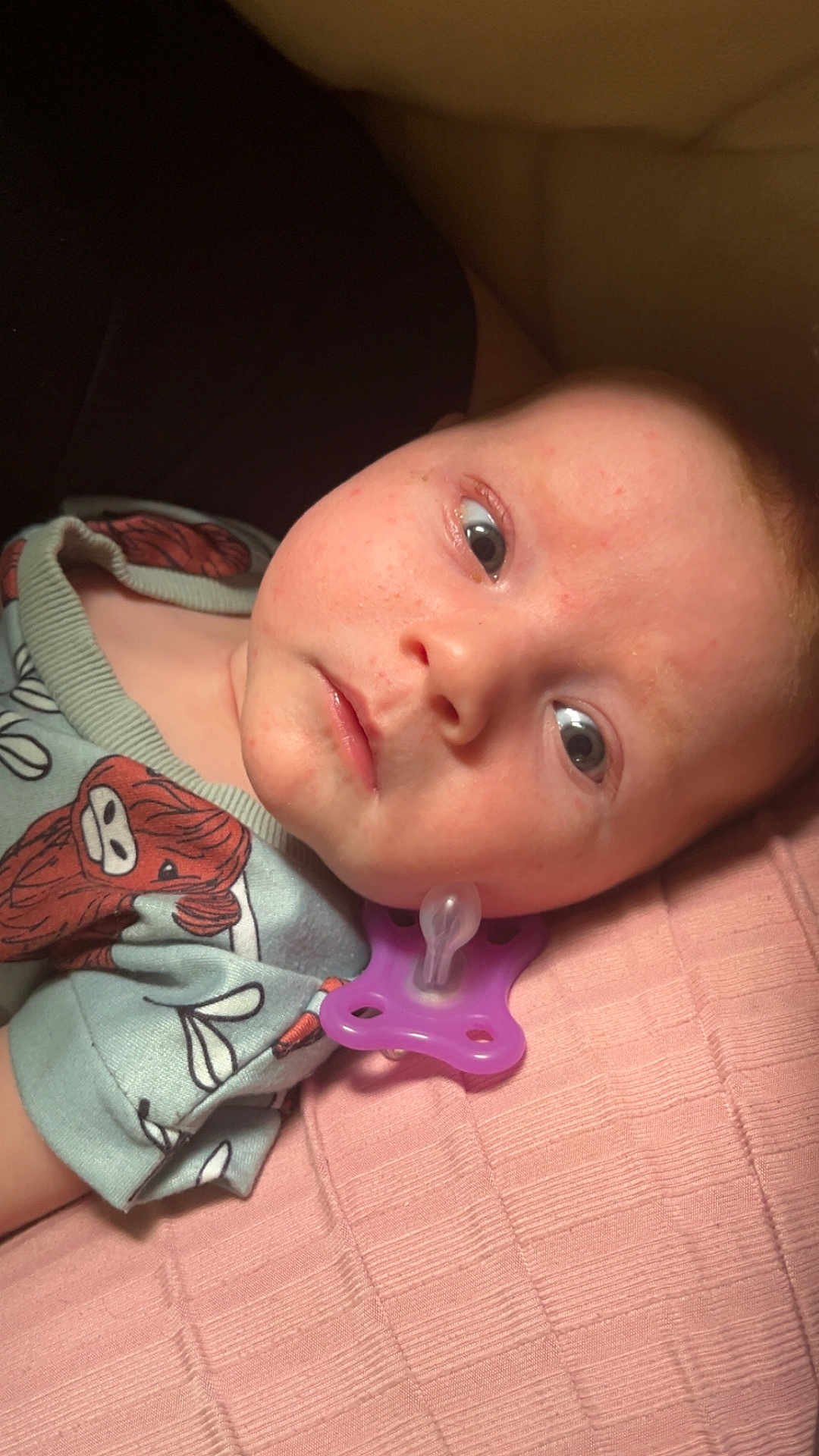 Emone joined the competition — help win amazing prizes! baby, blanket, blue, child, closeup, clothing, cute, expression, face, head, indoors, infant, lying_down, pacifier, pink, portrait, resting, skin, texture, young