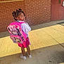 Journee joined the competition — help win amazing prizes! child, girl, backpack, pink, braids, sidewalk, brick_wall, door, shoes, smile, sunlight, outdoor, person, young, cute, standing, casual_clothing, school, innocent, playful