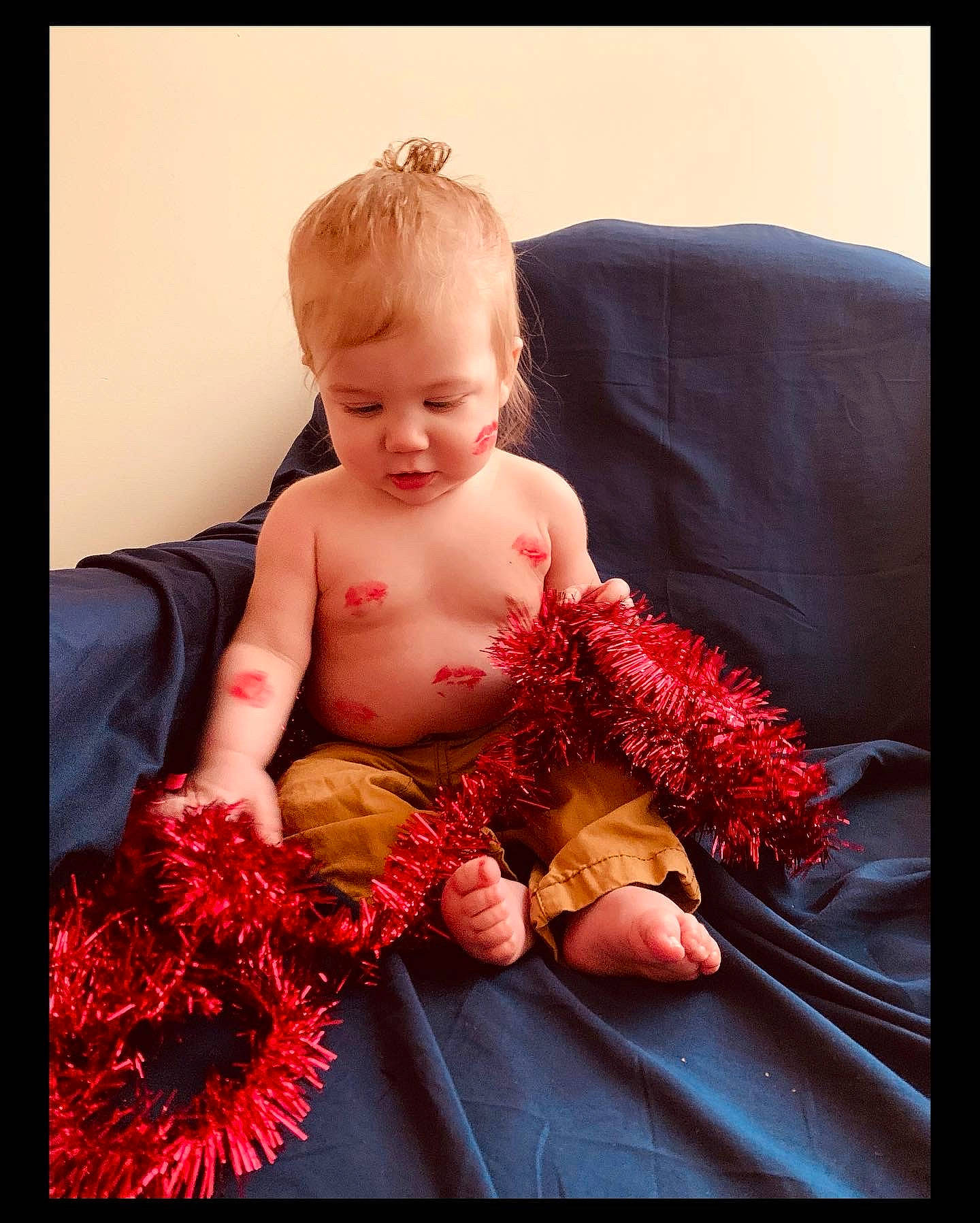 Jaxon joined the competition — help win amazing prizes! abdomen, baby, baby_toddler_clothing, barefoot, child, comfort, couch, cut_flowers, floral_design, foot, fur, happy, human_leg, magenta, peach, person, red, sitting, thigh, toddler