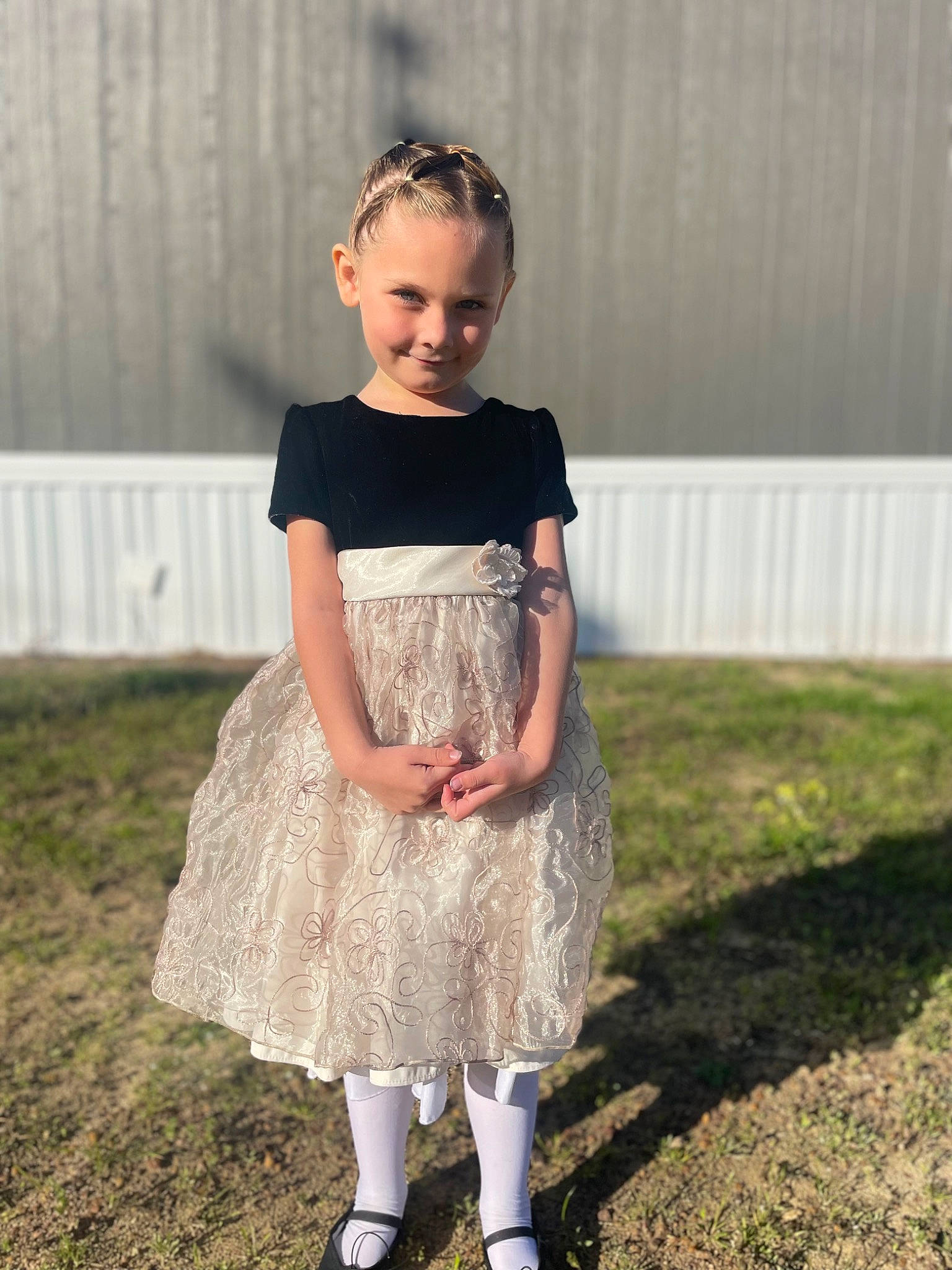 Haven is registered to the contest to win money with this photo: baby_toddler_clothing, child, day_dress, dress, embellishment, face, fashion_design, formal_wear, grass, grey, hairstyle, happy, jewellery, joy, neck, one_piece_garment, outerwear, person, shoulder, sleeve