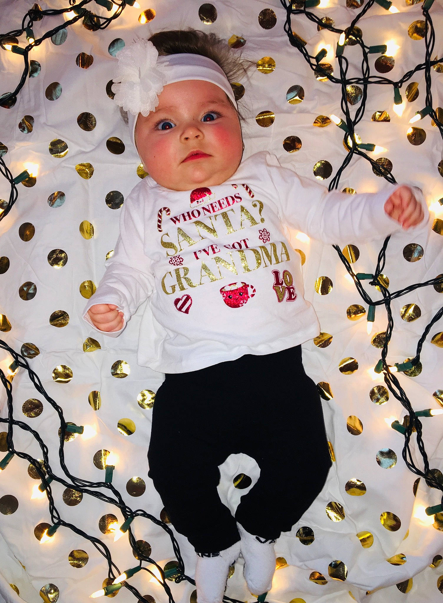 Leanna is registered to the contest to win money with this photo: child, design, facial_expression, fun, girl, hair_accessory, happiness, headgear, infant, pattern, person, pink, product, smile, textile, toddler, white