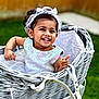 toddler, child, smiling, dress, headband, wicker_basket, outdoor, grass, greenery, happy, baby, portrait, cute, small_child, white, lace, fashion, sitting, playful, daylight