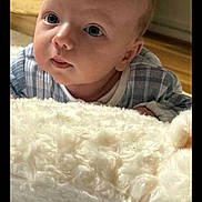 Noah-David joined the competition — help win amazing prizes! baby, infant, face, eyes, blanket, soft, indoor, curious, lying_down, child, person, cute, skin, head, clothing, plaid, floor, cozy, portrait, newborn