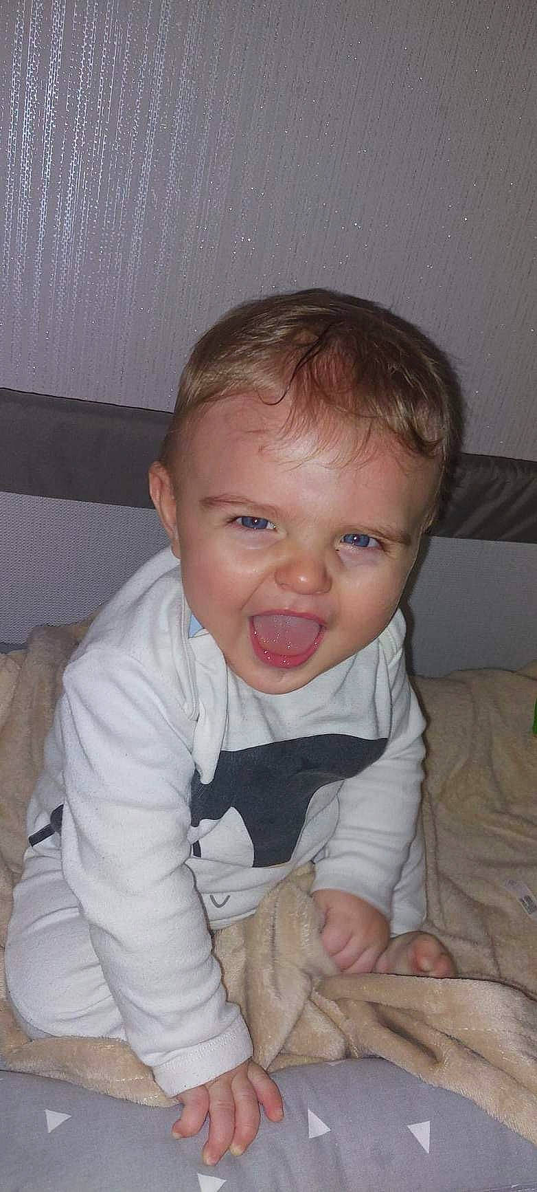 Caleb-james is registered to the contest to win money with this photo: arm, baby, baby_toddler_clothing, cheek, chin, comfort, ear, eyebrow, eyelash, finger, fun, gesture, hairstyle, iris, lip, mouth, nose, person, skin, sleeve